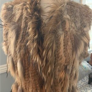 Love Token rabbit / raccoon.
fur vest size M